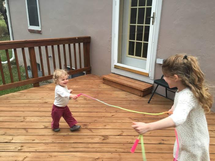 One of their favorite toys--a jump rope. Simple pleasures.